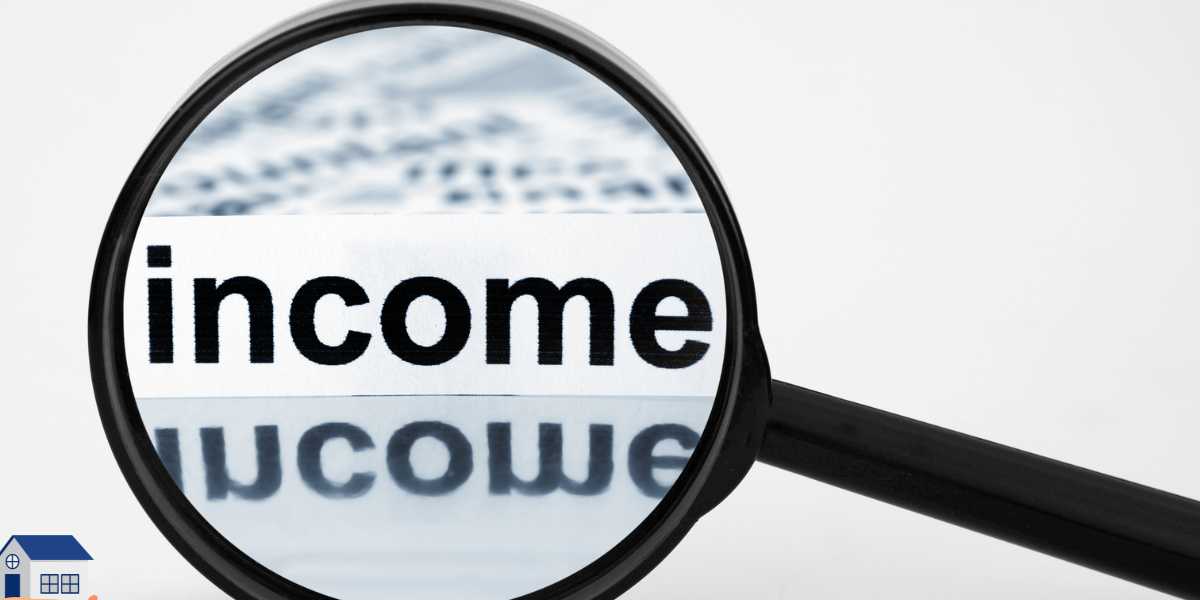 A magnifying glass focusing closely on the word "income" on a white page, representing family income assessment for student finance and university applications.